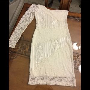 White/ cream colored lace design ladies dress.